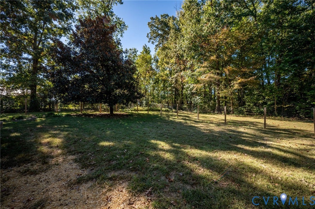 2790 Maidens Road, Powhatan, VA 23139 Expansive backyard featuring a level lawn, mature trees, and perimeter post-and-wire fencing