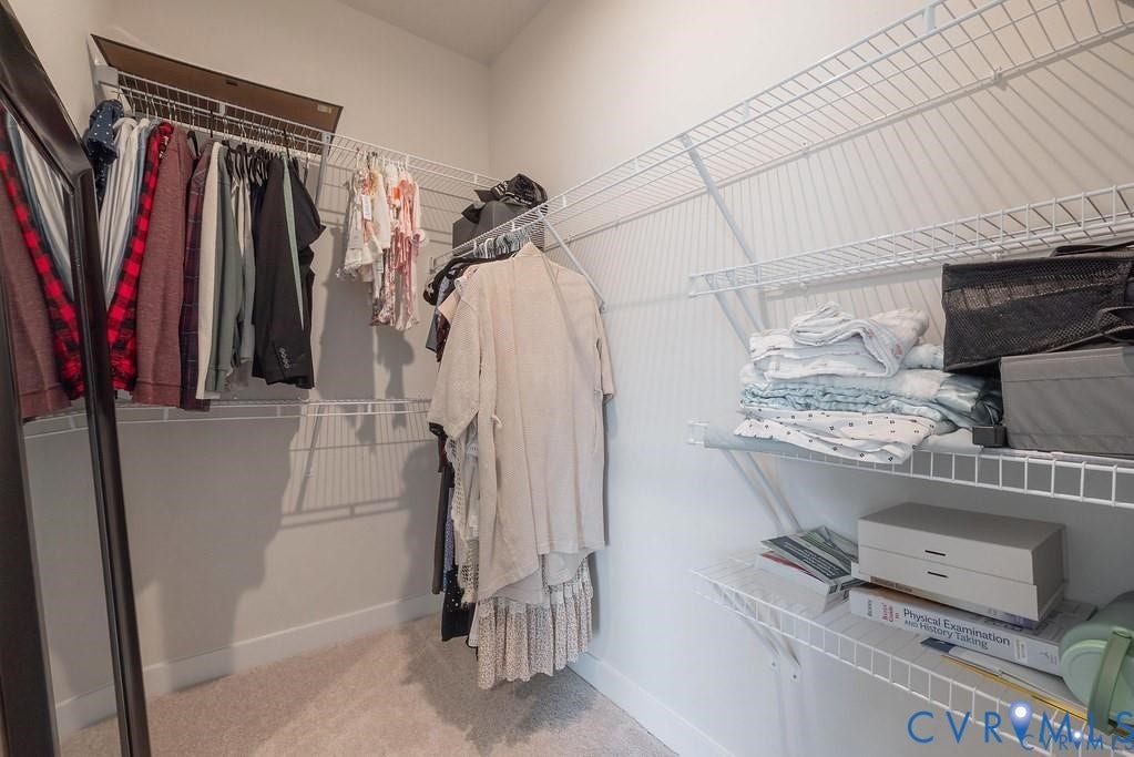 10221 Wenden Way, Hanover, VA 23005 Walk-in closet featuring tiered white wire shelving and wall-to-wall carpeting