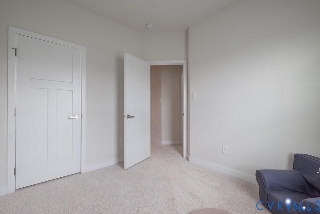10221 Wenden Way, Hanover, VA 23005 Neutral interior featuring carpeting, light-toned wall finishes, and two-panel shaker-style interior doors with brushed nickel hardware