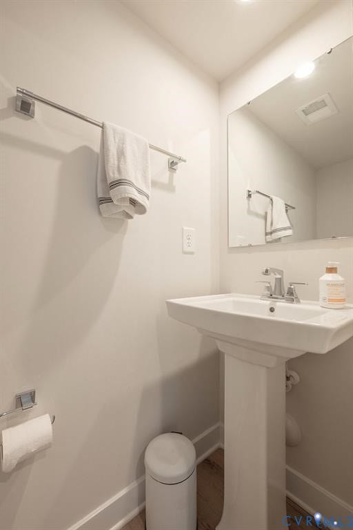 10221 Wenden Way, Hanover, VA 23005 Pedestal sink with chrome faucet, large rectangular mirror, and chrome towel hardware