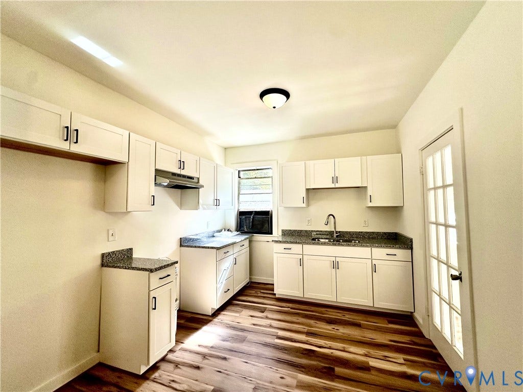 15051 BENT CREEK ROAD, Morven, Amelia, VA 23002 Kitchen featuring white shaker-style cabinetry, stone-finish countertops, wood-finish flooring, a stainless steel sink with a gooseneck faucet, and a multi-pane glass door