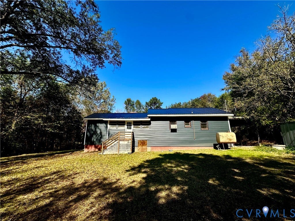 15051 BENT CREEK ROAD, Morven, Amelia, VA 23002 Exterior featuring dark horizontal siding, a metal roof, and wood-framed stairs