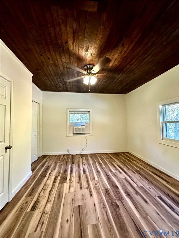 15051 BENT CREEK ROAD, Morven, Amelia, VA 23002 Interior room featuring a natural wood-plank ceiling, wood-finish flooring, two windows, and a built-in ceiling fan with light fixture