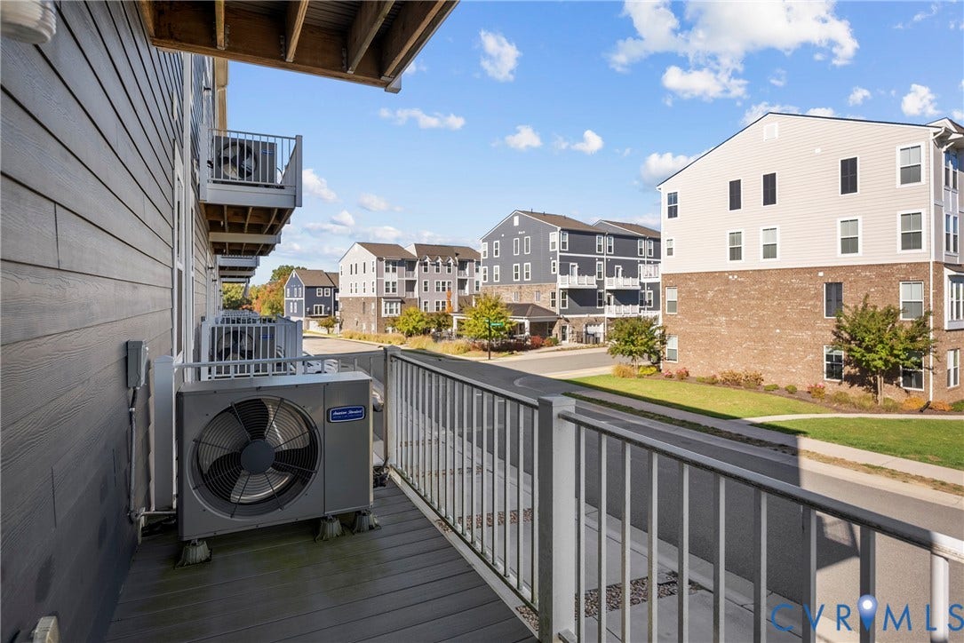 14501 Hancock Towns Drive, Chesterfield, VA 23832 Elevated balcony featuring composite decking, white metal railing, and exterior siding