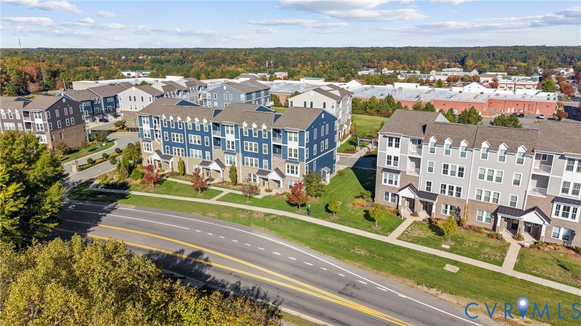 14501 Hancock Towns Drive, Chesterfield, VA 23832 Multi-story residential buildings featuring gabled rooflines, fiber-cement siding, stone veneer facades, and manicured green spaces