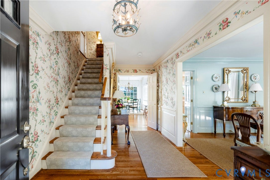 205 Poplar Lane, South Of Cary Street Rd, Richmond, VA 23226 The entry foyer features a hardwood floor, wainscoting, crown moulding, a decorative lantern-style chandelier, and stairs with runner to the second floor.