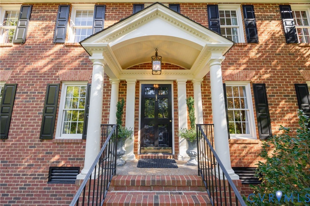 205 Poplar Lane, South Of Cary Street Rd, Richmond, VA 23226 The front entry feaures a classical pedimented portico, dual white columns, a multi-pane front door, and symmetrical dark shutters