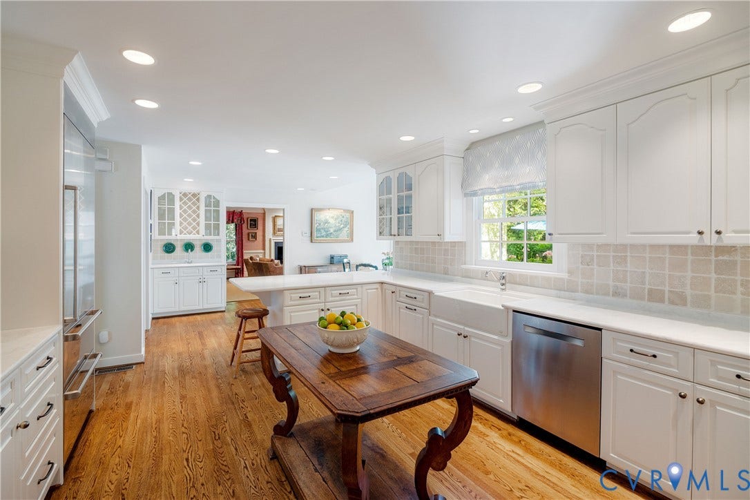205 Poplar Lane, South Of Cary Street Rd, Richmond, VA 23226 Stainless appliances include a gas cooktop and Sub-Zero refrigerator with two freezer drawers.