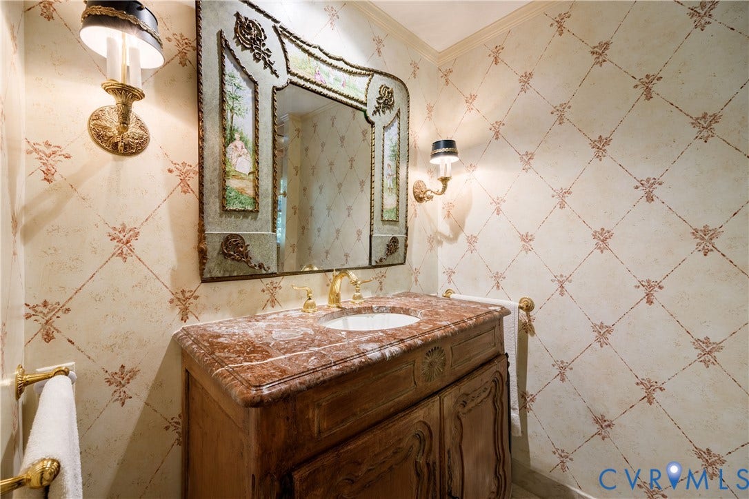 205 Poplar Lane, South Of Cary Street Rd, Richmond, VA 23226 The primary bath features a wood cabinet/vanity with marble counter and decorative mirror.