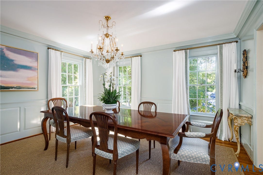 205 Poplar Lane, South Of Cary Street Rd, Richmond, VA 23226 The recently refreshed formal dining room features handsome wainscoting, windows with beautiful views, crown moulding, and a tiered crystal chandelier