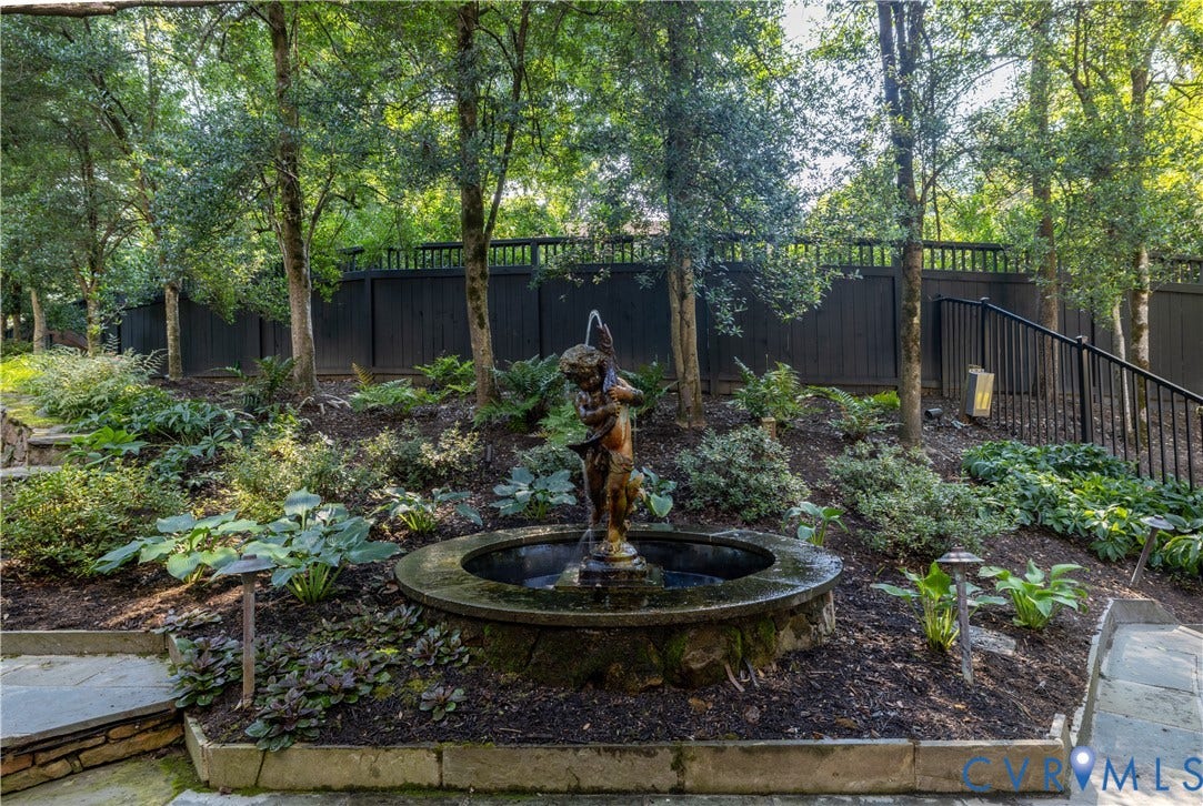 205 Poplar Lane, South Of Cary Street Rd, Richmond, VA 23226 Rear entrance to the landscaped garden features a tiered stone fountain, mature trees, tiered stone retaining walls, and fencing around the entire rear yard.