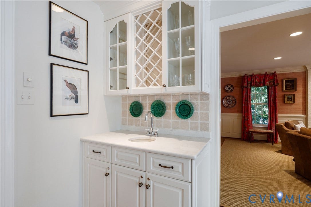 205 Poplar Lane, South Of Cary Street Rd, Richmond, VA 23226 Built-in bar features a bar sink and lots of glassware storage.