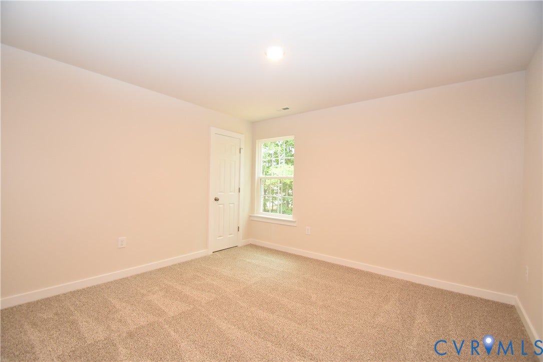 Lot 1 Bannister Town Road, Courtney Farms, Louisa, VA 23093 Neutral wall-to-wall carpeting, single-panel interior door, and double-hung window with natural exterior exposure