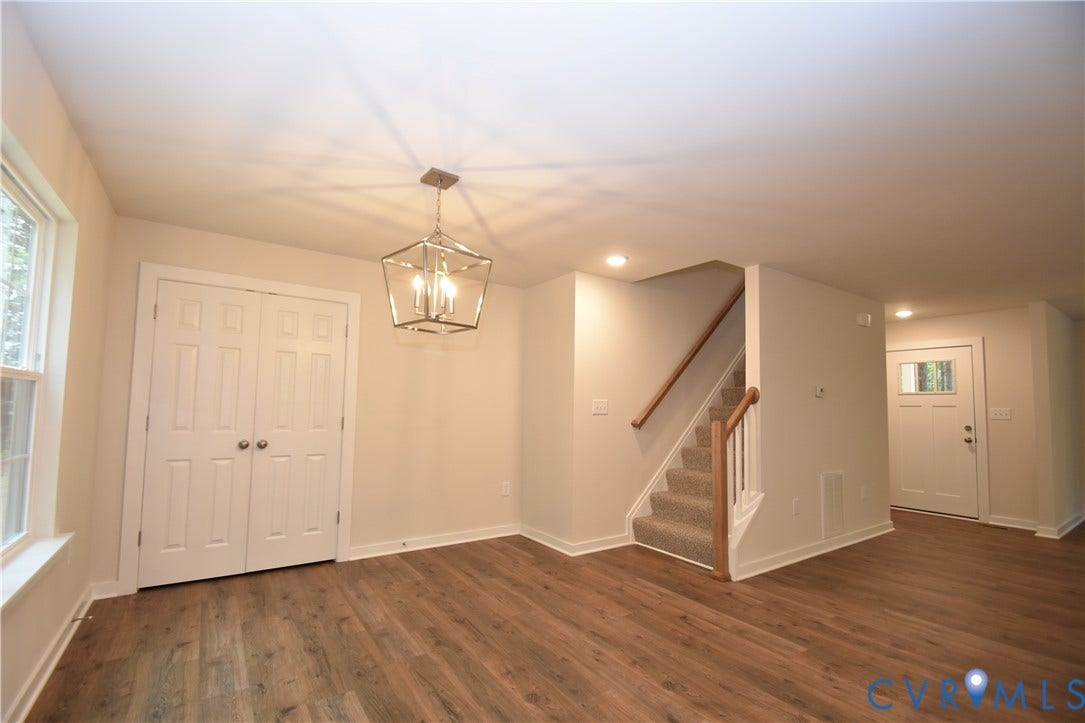 Lot 1 Bannister Town Road, Courtney Farms, Louisa, VA 23093 Wood-finish flooring, geometric metal pendant lighting, double-panel doors, and staircase with a wood handrail