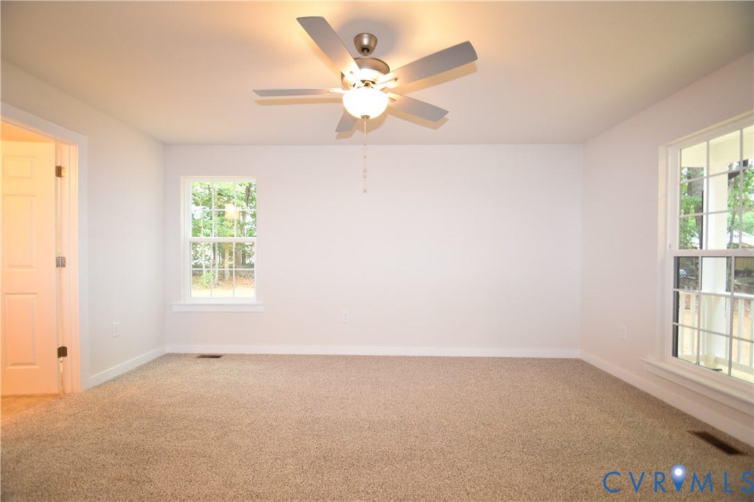Lot 1 Bannister Town Road, Courtney Farms, Louisa, VA 23093 Neutral-toned carpeting, multi-pane windows, and a central ceiling fan with integrated lighting