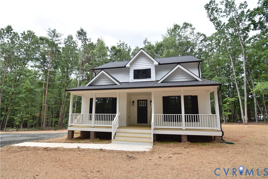 Lot 1 Bannister Town Road, Courtney Farms, Louisa, VA 23093 Two-story residence featuring a covered front porch with white railing, horizontal siding, black exterior shutters, and multiple dormers