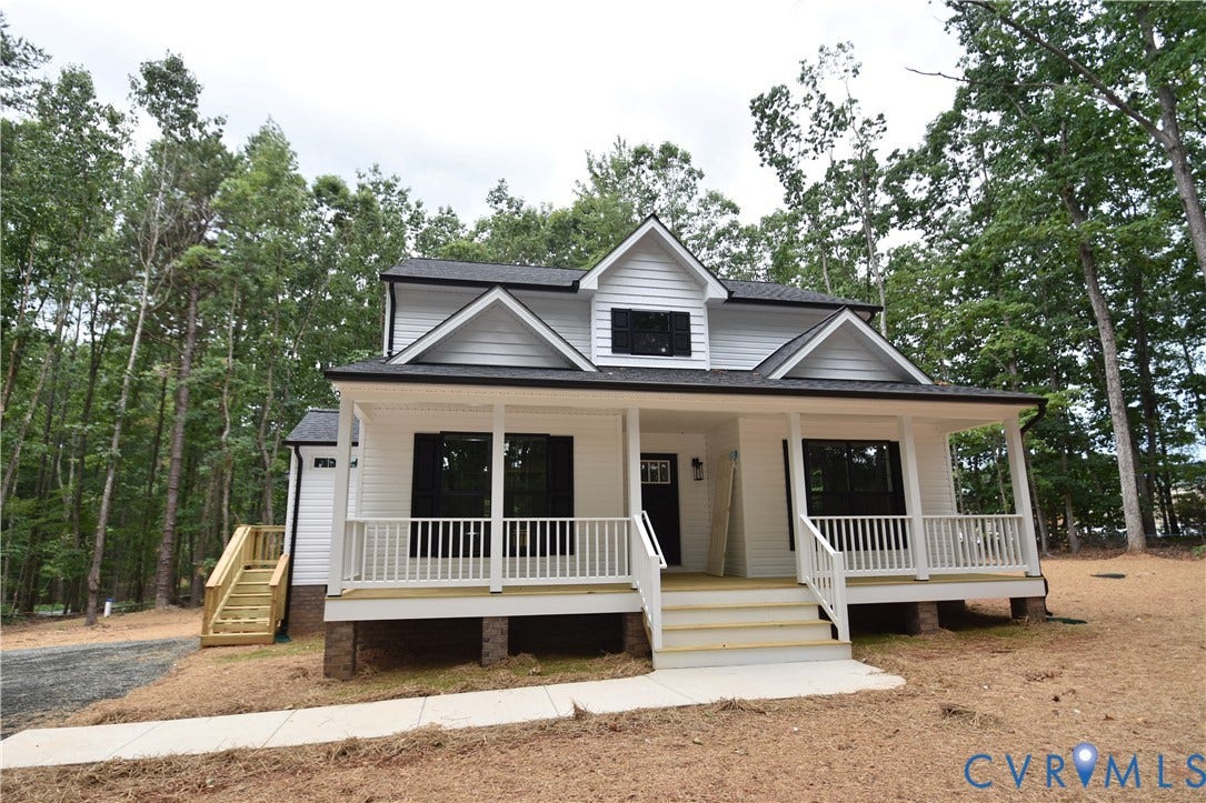 Lot 1 Bannister Town Road, Courtney Farms, Louisa, VA 23093 Exterior facade featuring white horizontal siding, dark shutters, a covered front porch with white railing, and a gabled roofline
