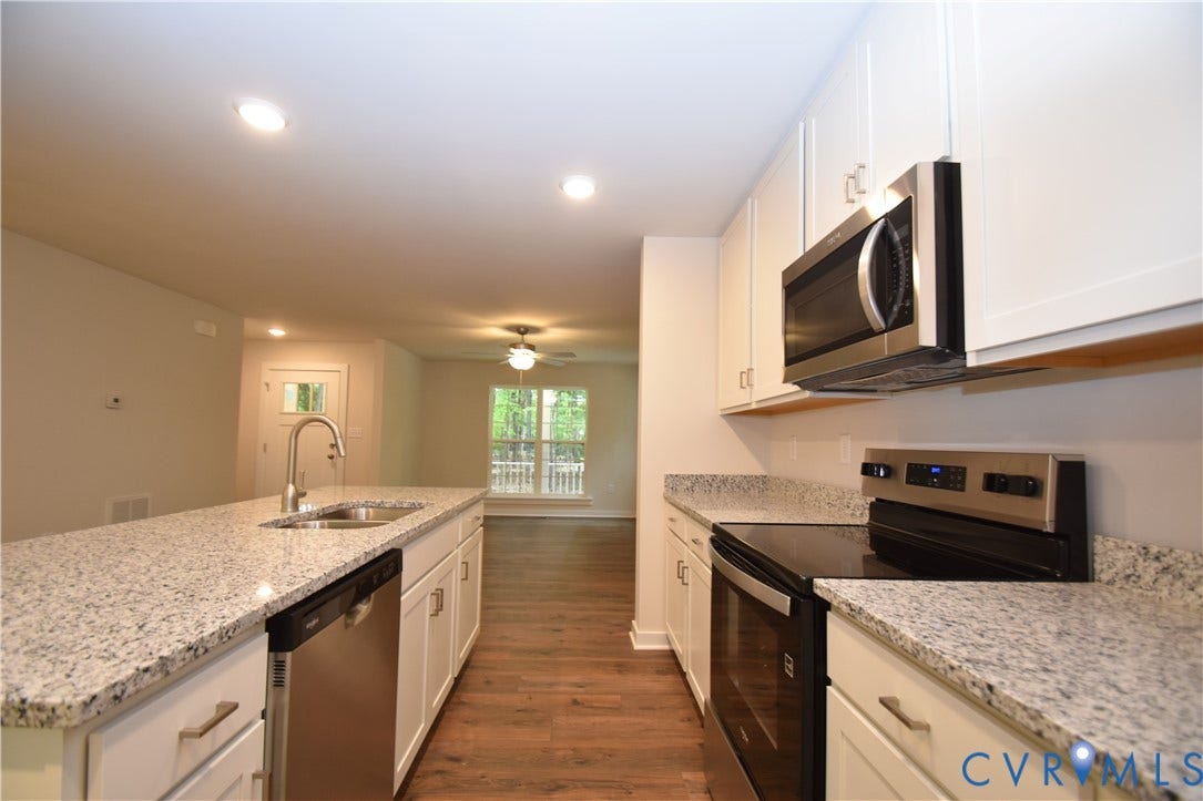 Lot 1 Bannister Town Road, Courtney Farms, Louisa, VA 23093 Kitchen featuring white shaker-style cabinetry, stone-surface countertops, stainless steel appliances, recessed lighting, and wood-finish flooring