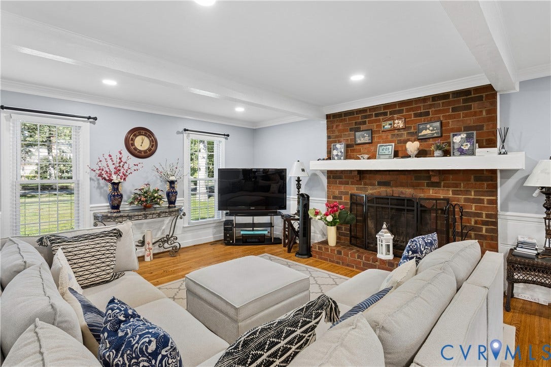 327 Huddersfield Drive, Chesterfield, VA 23236 Living area featuring exposed ceiling beams, hardwood flooring, brick fireplace with a mantel, and recessed lighting