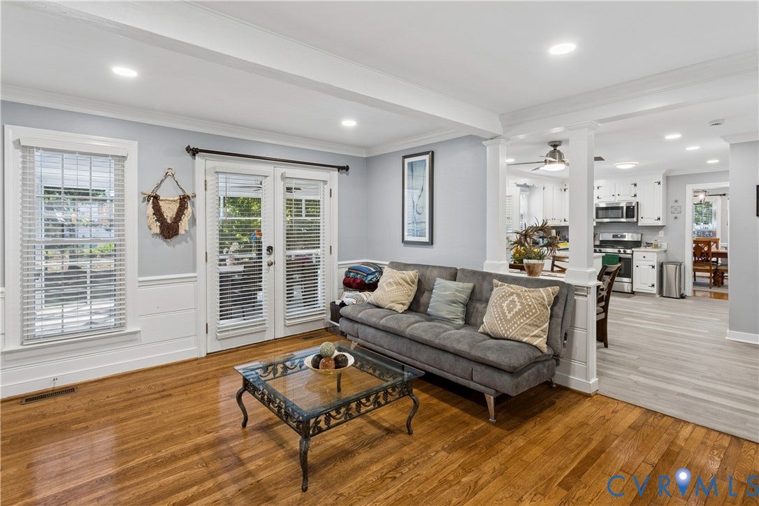 327 Huddersfield Drive, Chesterfield, VA 23236 Hardwood flooring, wood-panel wainscoting, glass-paned double doors, and white-painted architectural columns