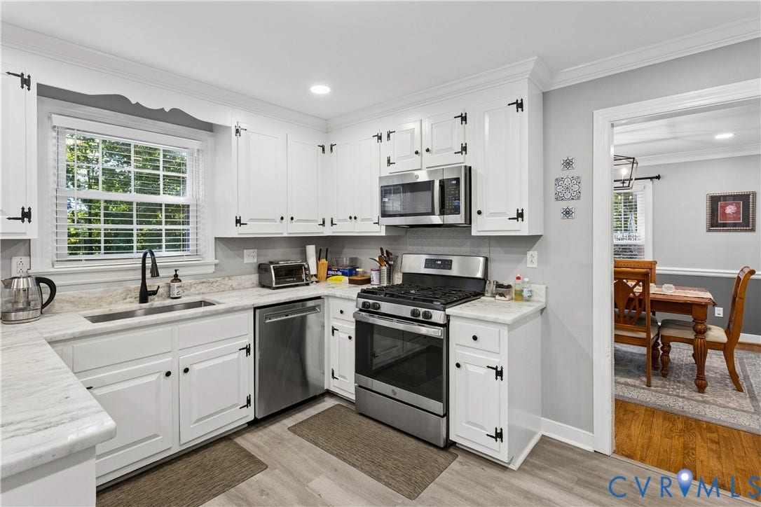 327 Huddersfield Drive, Chesterfield, VA 23236 Kitchen featuring white cabinetry with matte black hardware, stone-finish countertops, stainless steel appliances, and wood-finish flooring