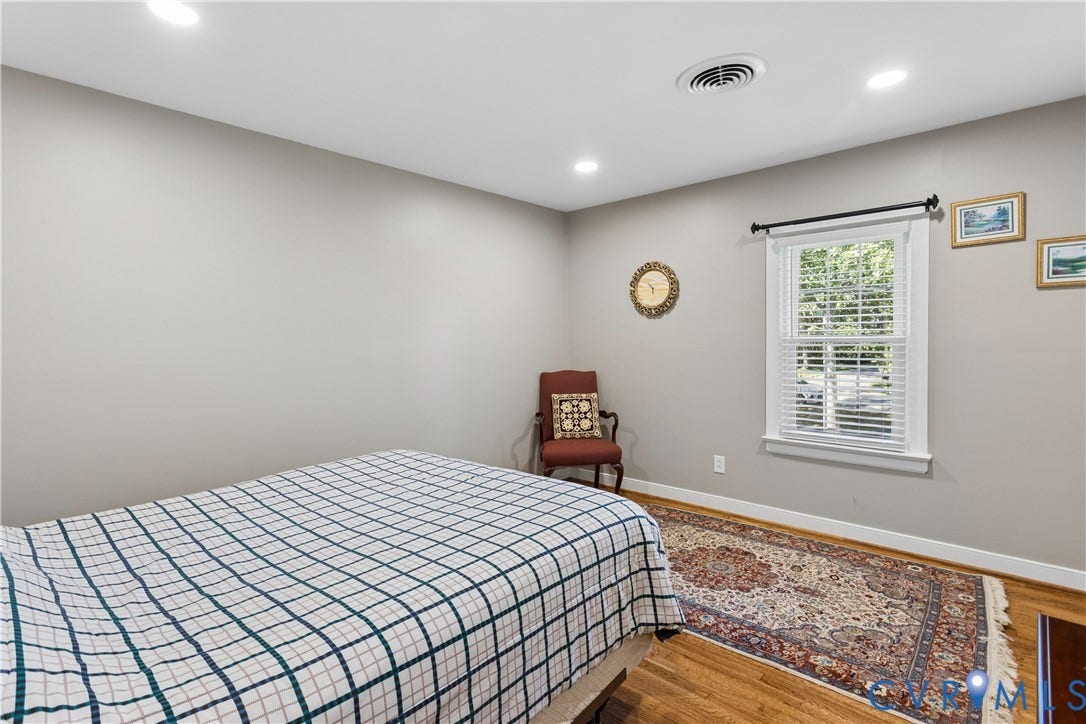 327 Huddersfield Drive, Chesterfield, VA 23236 Neutral wall color, wood-finish flooring, recessed lighting, and a window with white trim
