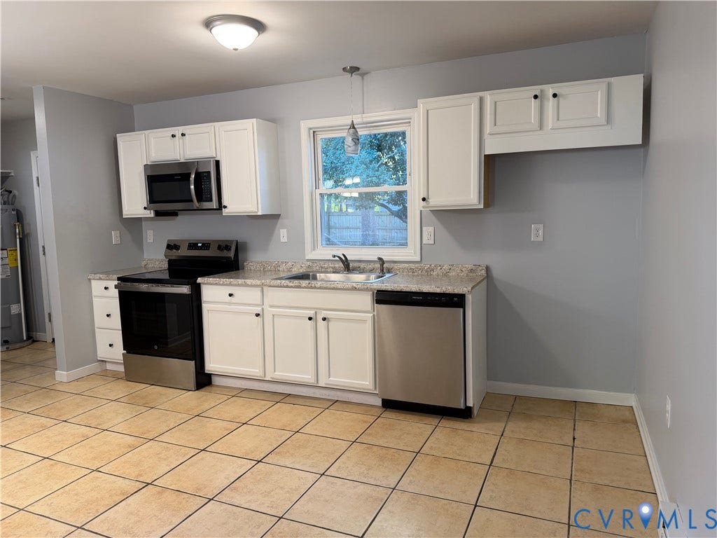 6149 Thierry Street, North Chesterfield, VA 23234 Kitchen featuring white cabinetry, stone-finish countertops, stainless steel appliances, and tile flooring