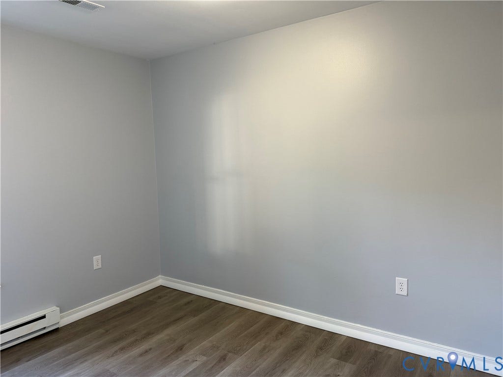6149 Thierry Street, North Chesterfield, VA 23234 Neutral-toned interior walls featuring wood-finish flooring and white trim