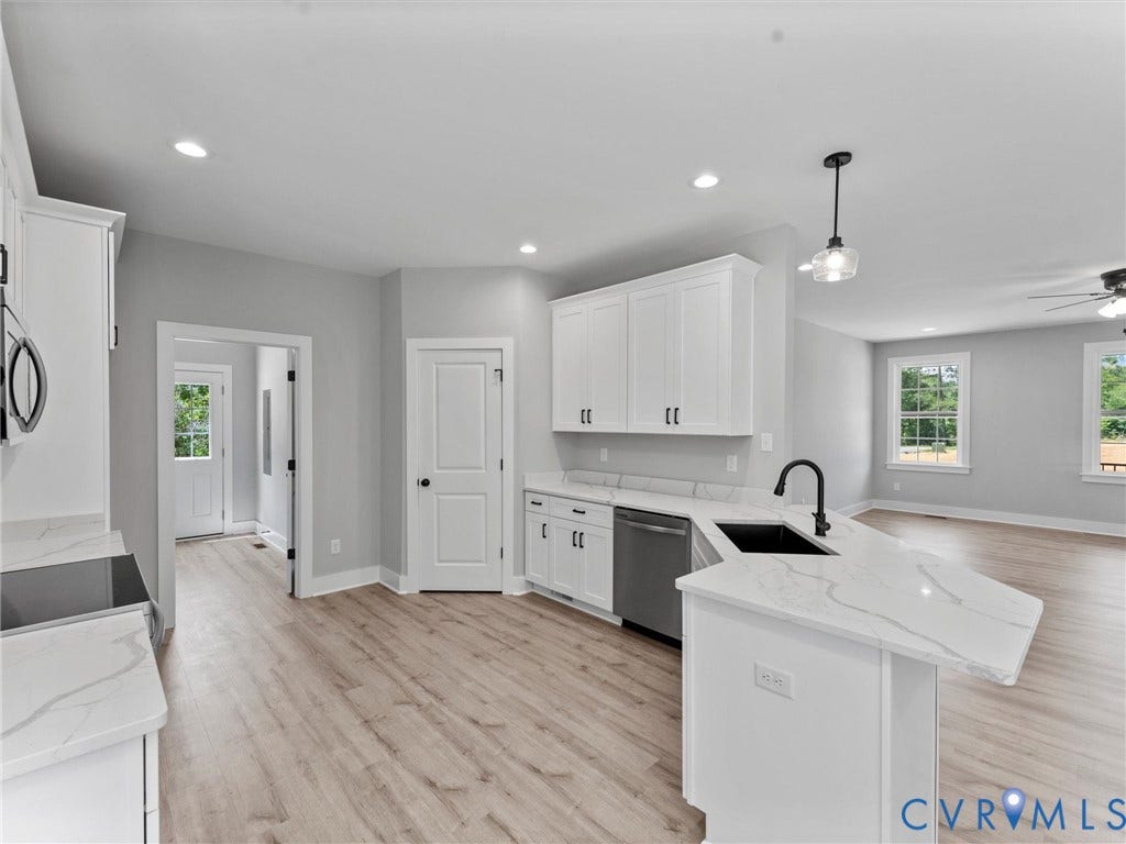 5951 Pot Rock Lane, Pot Rock Ln, Jetersville, VA 23083 Kitchen featuring white shaker-style cabinetry, white countertops with grey veining, a matte black faucet with an undermount sink, recessed lighting, and wood-finish flooring