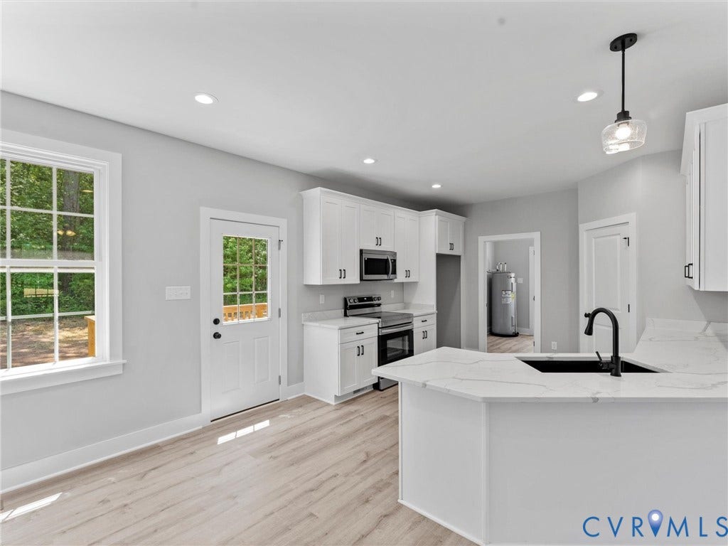 5951 Pot Rock Lane, Pot Rock Ln, Jetersville, VA 23083 Kitchen featuring white cabinetry, light-toned wood-finish flooring, stone-finish countertops with veining, an undermount sink with a matte black faucet, and recessed lighting
