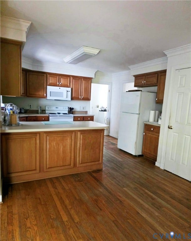 3350 North Road, Sandy Hook, VA 23153 Kitchen featuring wood cabinetry, wood-finish flooring, a kitchen island, crown molding, and white appliances