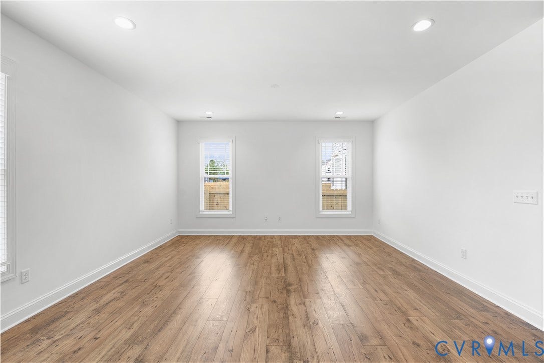 652 Overby Bend Road, Highland Grove, Richmond, VA 23222 Spacious room featuring wood-finish flooring, white walls, and recessed lighting