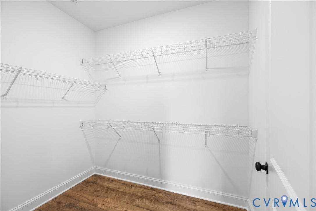 652 Overby Bend Road, Highland Grove, Richmond, VA 23222 Interior room with white walls and wood-finish flooring