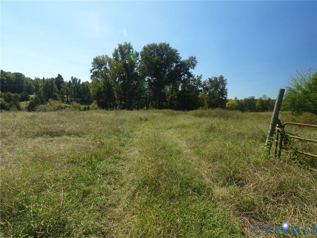 00 Patrick Henry HWY, Detached, Burkeville, VA 23922 Expansive acreage featuring rolling meadow terrain, clusters of mature hardwood trees, and metal fencing