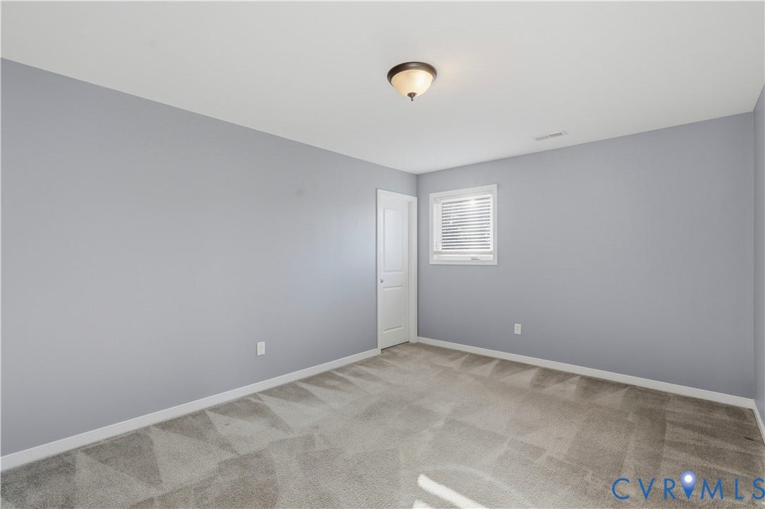 11936 Helmway Court, Chester, VA 23839 Bedroom #3 Room featuring neutral-toned carpeting, light gray wall paint, a single-panel interior door, a recessed window with horizontal blinds, and a dome-style flush-mount ceiling light