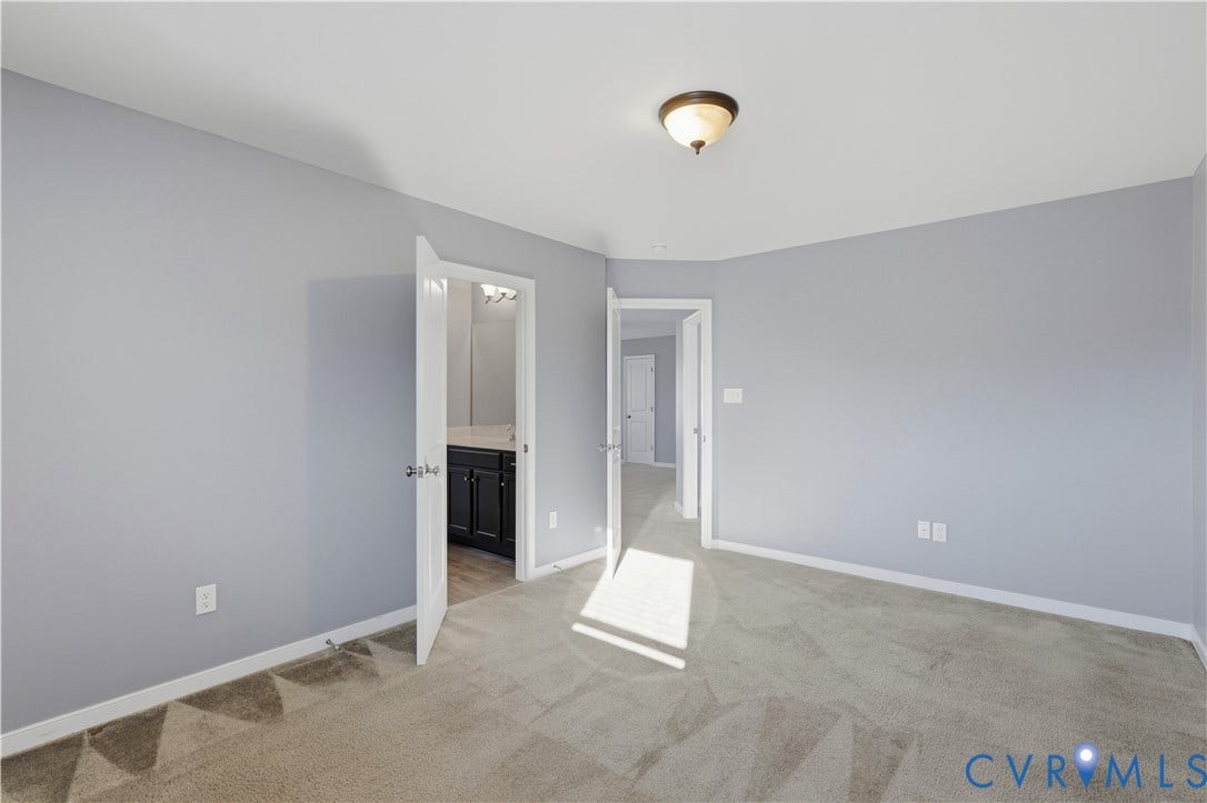11936 Helmway Court, Chester, VA 23839 Bedroom #3 Neutral-toned wall paint, neutral carpeting, and a flush-mount ceiling light fixture
