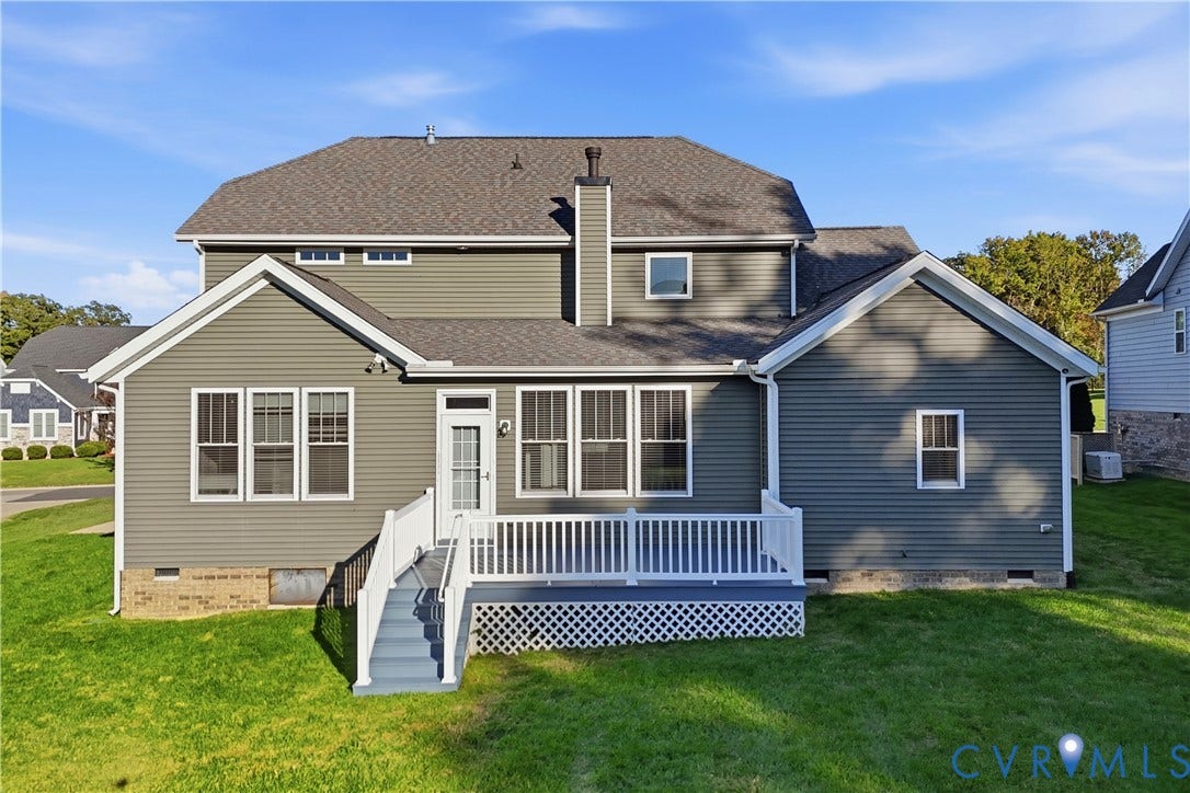 11936 Helmway Court, Chester, VA 23839 Two-story exterior featuring grey horizontal siding, a composite shingle roof, a raised deck with white railings, and a brick foundation trim
