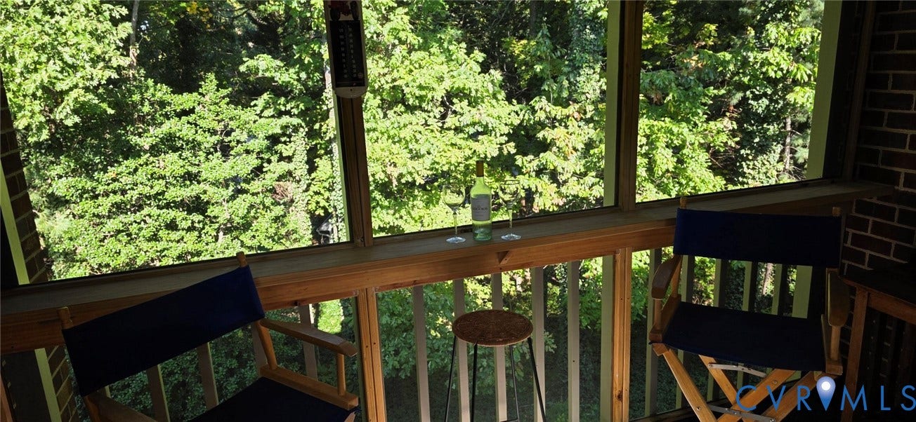 2106 Turtle Run Drive, #11, Henrico, VA 23233 Screened-in porch featuring a wood railing, built-in ledge, and exposed brick wall
