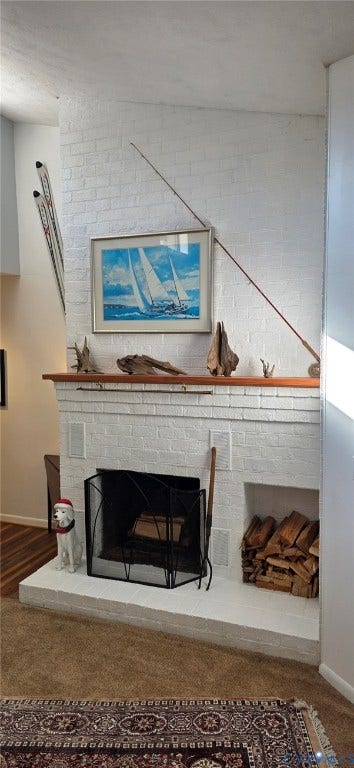 2106 Turtle Run Drive, #11, Henrico, VA 23233 White painted brick fireplace featuring a wood mantel and an integrated firewood storage niche