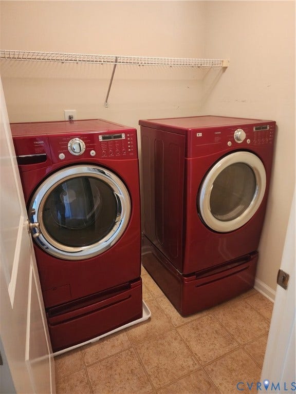 9031 Annex Lane, Mechanicsville, VA 23116 Laundry area featuring side-by-side high-capacity washer and dryer units with pedestal storage drawers and an overhead wire shelving rack