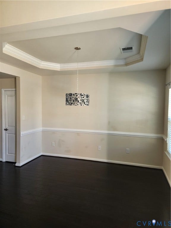 9031 Annex Lane, Mechanicsville, VA 23116 Tray ceiling with crown molding, dark wood-finish flooring, chair rail wainscoting, and drum pendant lighting