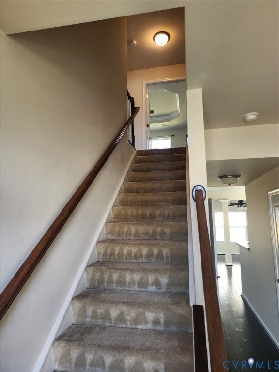 9031 Annex Lane, Mechanicsville, VA 23116 Staircase featuring neutral carpeted treads, wood-finish handrails, and flush-mount lighting fixtures