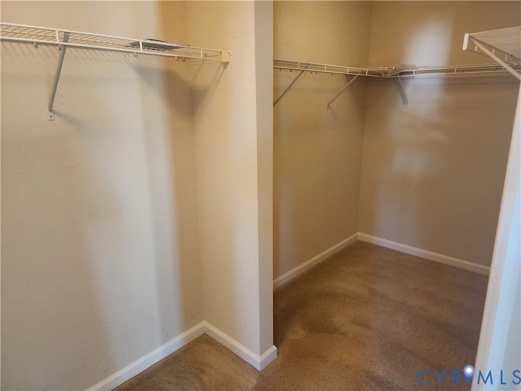9031 Annex Lane, Mechanicsville, VA 23116 Walk-in storage space featuring neutral wall paint, wall-to-wall carpeting, and white wire shelving
