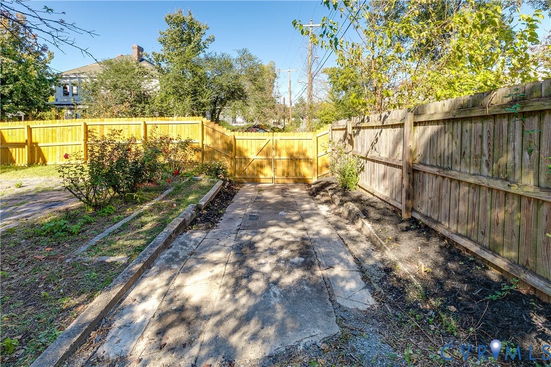 2005 Barton Avenue, Barton Heights, Richmond, VA 23222 Fenced outdoor area featuring a concrete surface, wood-style gate, and mature landscaping