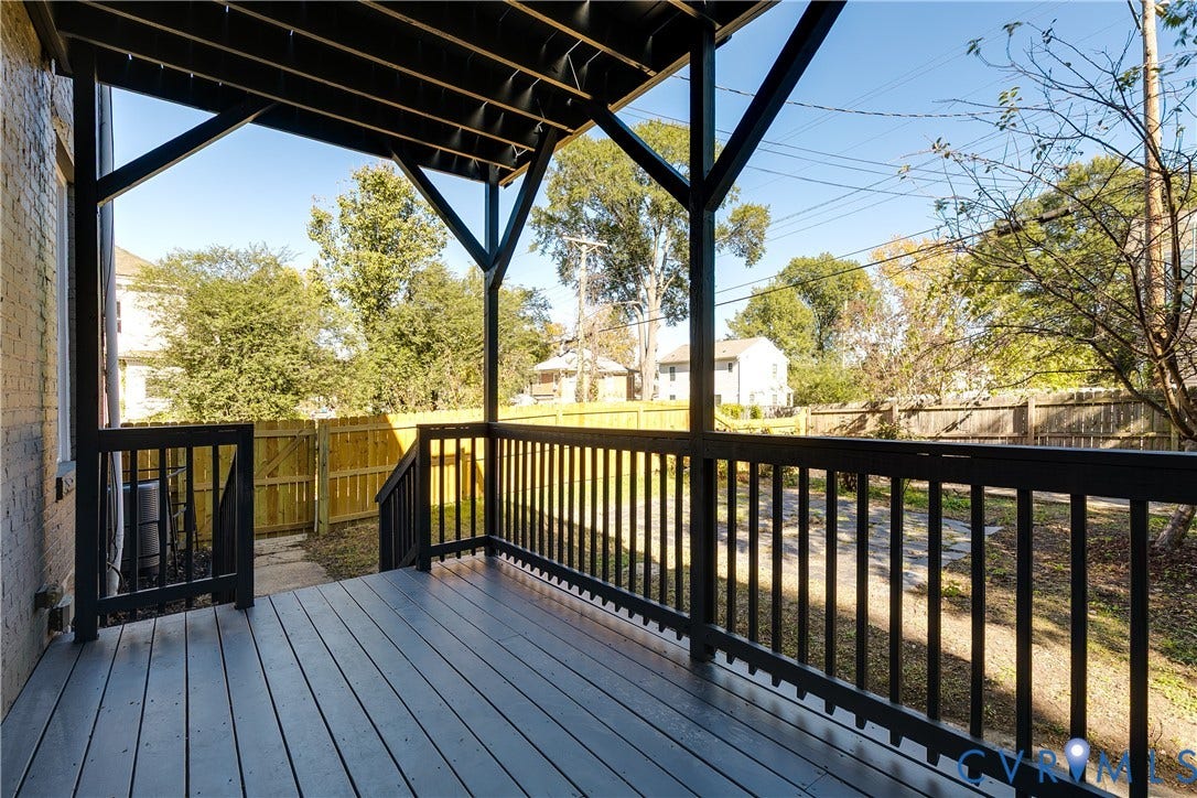 2005 Barton Avenue, Barton Heights, Richmond, VA 23222 Covered wooden deck featuring dark-toned floorboards, black structural support beams, and matching black railings
