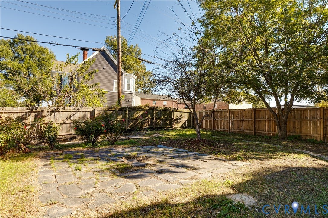 2005 Barton Avenue, Barton Heights, Richmond, VA 23222 Backyard featuring a stone-paver patio, wood-slat perimeter fencing, and mature trees