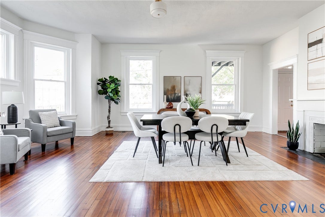 2005 Barton Avenue, Barton Heights, Richmond, VA 23222 Interior space featuring wood-finish flooring, bay windows, a decorative fireplace surround, and ceiling-mounted light fixture