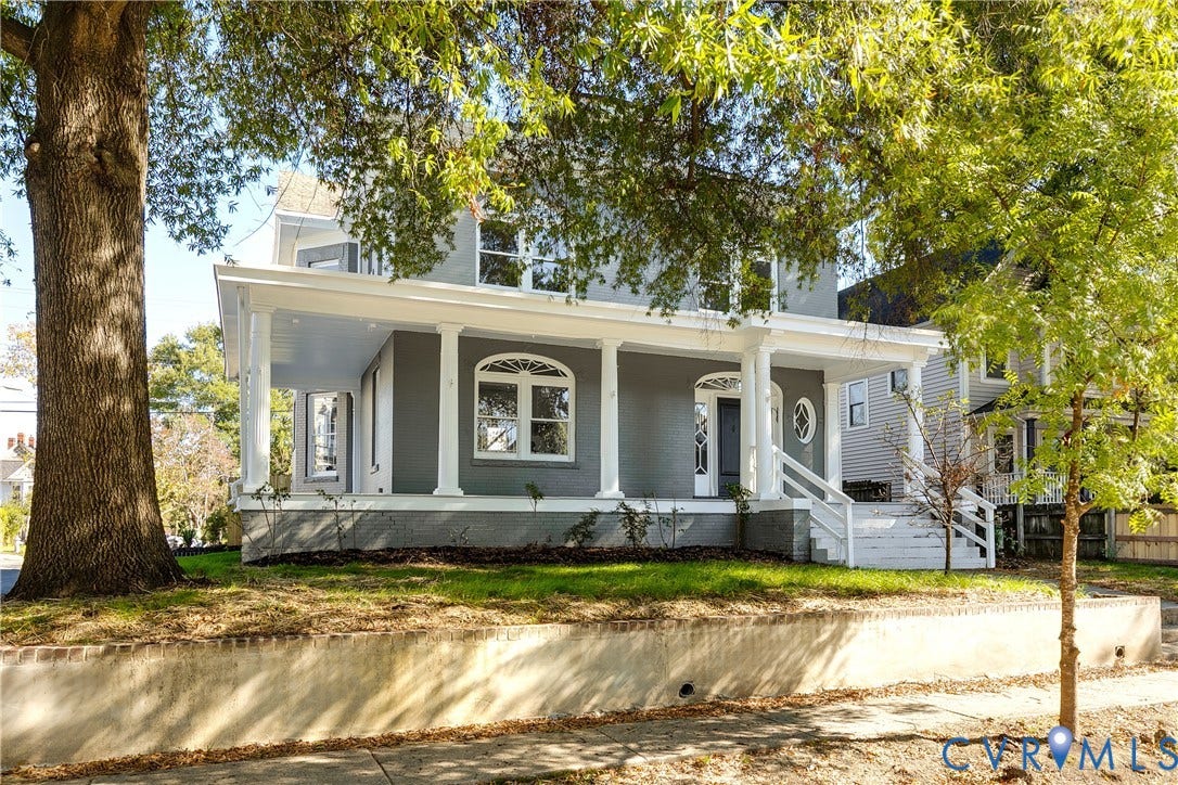 2005 Barton Avenue, Barton Heights, Richmond, VA 23222 Two-story exterior featuring a wraparound porch, classical columns, arched window detailing, and a concrete retaining wall