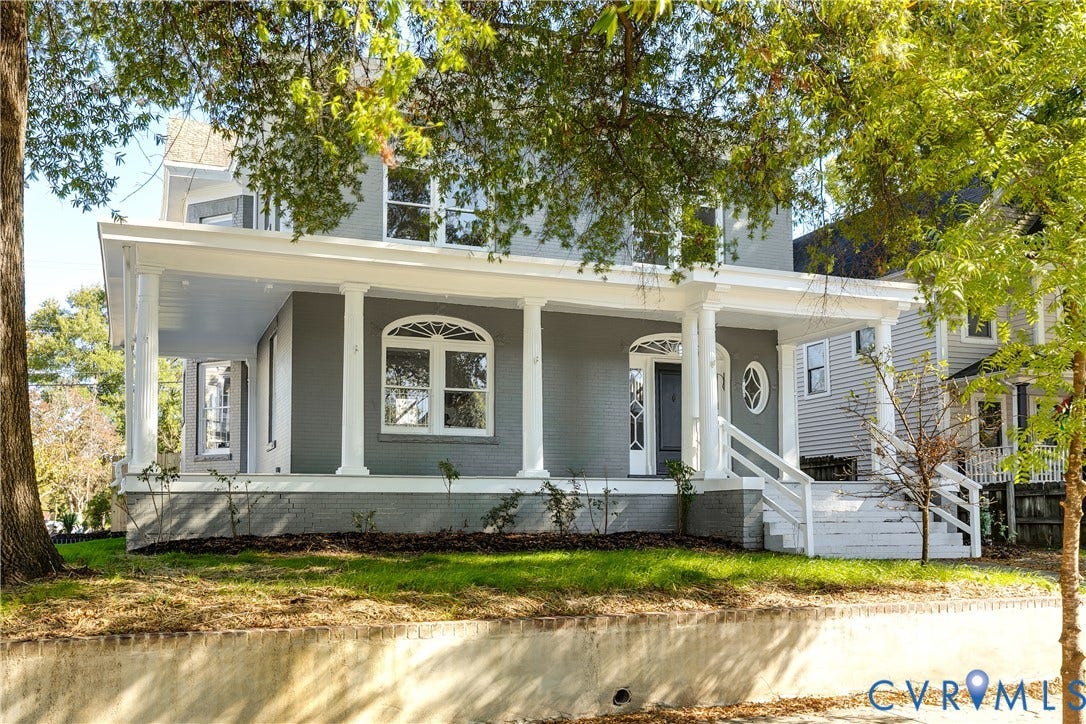 2005 Barton Avenue, Barton Heights, Richmond, VA 23222 Two-story painted brick exterior featuring a wide covered front porch with classical columns, arched window detailing, and a multi-light transom door