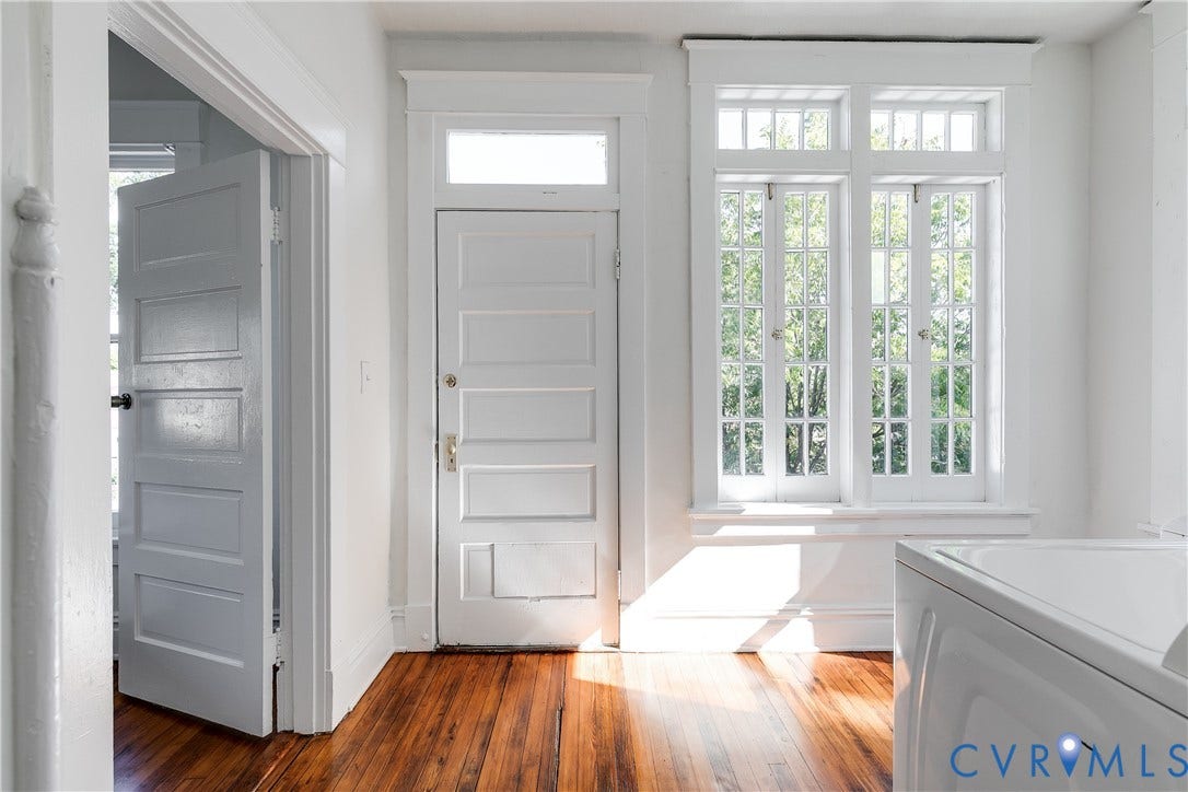 2005 Barton Avenue, Barton Heights, Richmond, VA 23222 Original wood-finish flooring, multi-pane casement windows, five-panel interior door with transom window, and architectural millwork trim